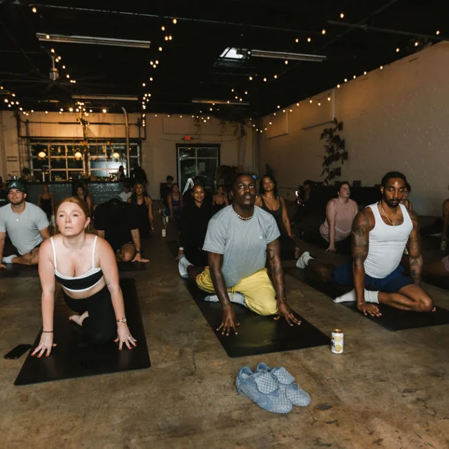Full Kinfolk Pilates class on mats at Yacht Club
