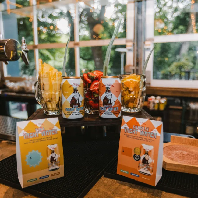 Pina and Sunrise Yacht Water cocktails on the bar at Yacht Club